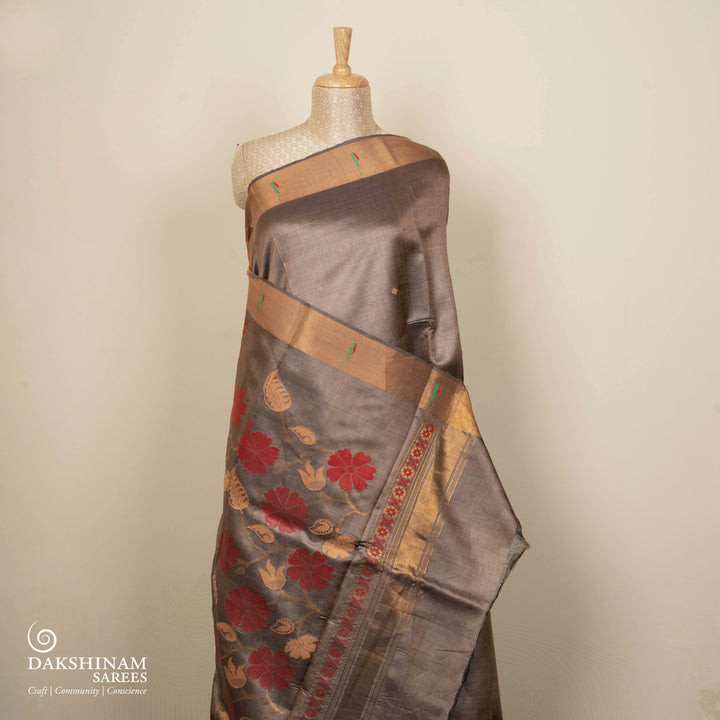 Grey tussar silk Paithani saree with floral butta, gold zari border and red sandal jamdani floral pallu with matching blouse