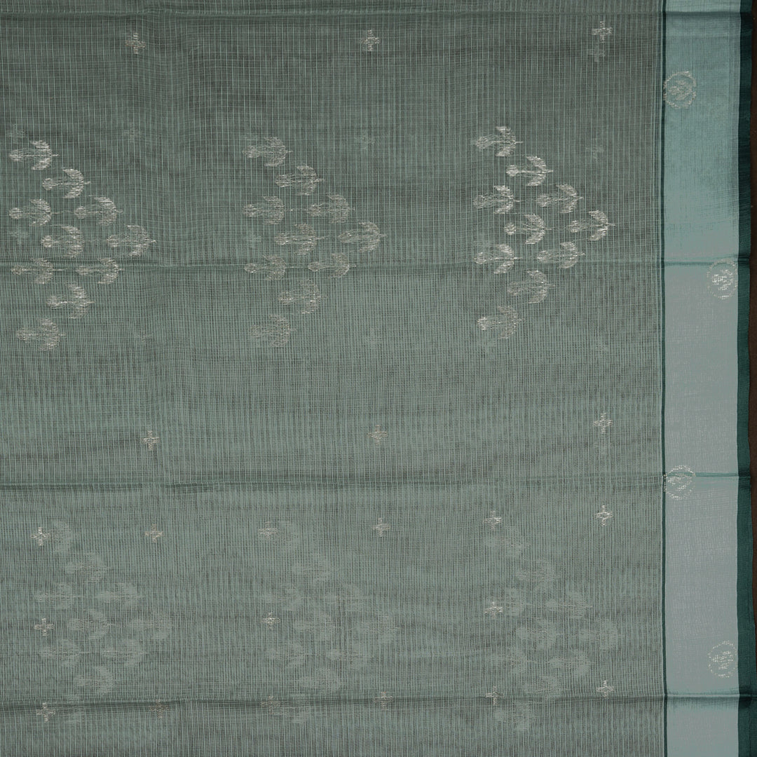 Moss green Kota doria silk saree with silver zari floral motifs, monotone border and pallu with silk thread flowers and chevron blouse