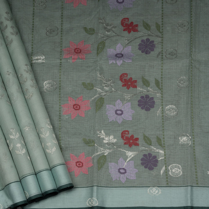 Moss green Kota doria silk saree with silver zari floral motifs, monotone border and pallu with silk thread flowers and chevron blouse