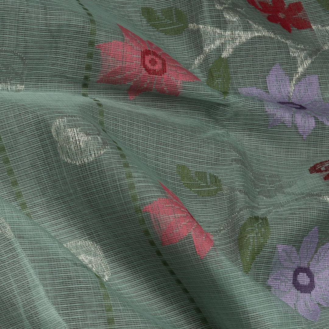 Moss green Kota doria silk saree with silver zari floral motifs, monotone border and pallu with silk thread flowers and chevron blouse