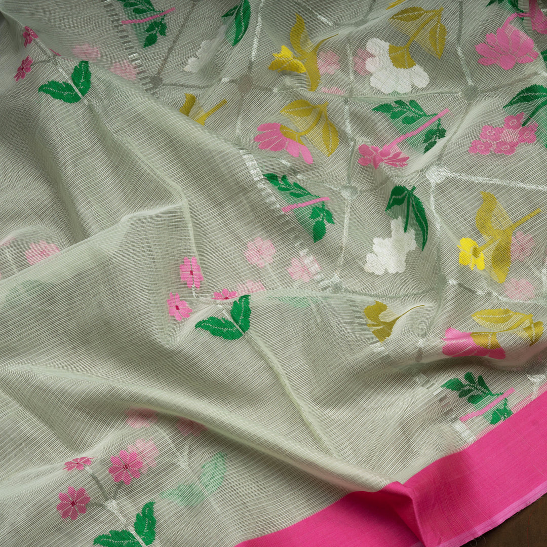 Light green Kota doria silk saree with silver zari floral motifs, silk thread flowers, diamond pallu and pink border with matching blouse