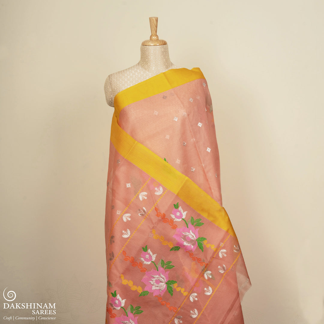 Peach Kota doria silk saree with silver zari plus butta, silk thread floral pallu and yellow border with matching blouse
