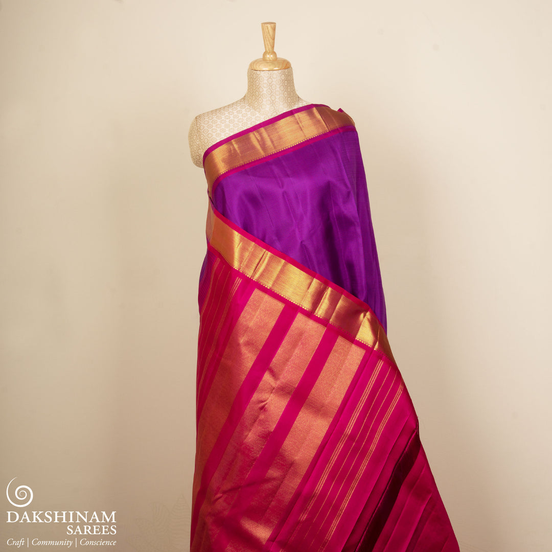 Violet Kanjivaram silk saree with pink small checks, magenta gold zari border and panel zari pallu with matching blouse