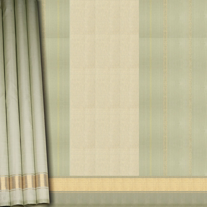 Light green Kanjivaram silk saree with gold zari diagonal chevron lines and striped panel pallu with matching blouse