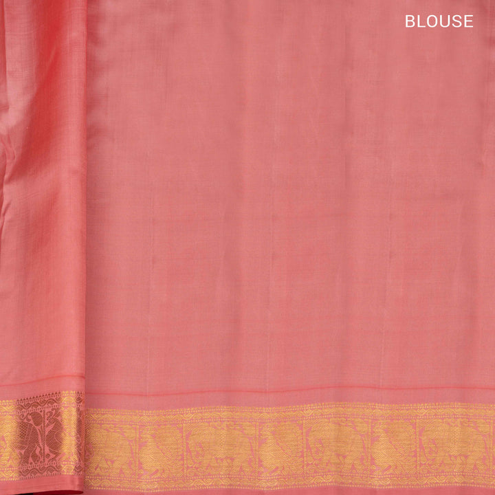 Pink Kanjivaram silk saree with gold zari mango butta, light pink pallu with peacock and elephant motifs, and matching blouse
