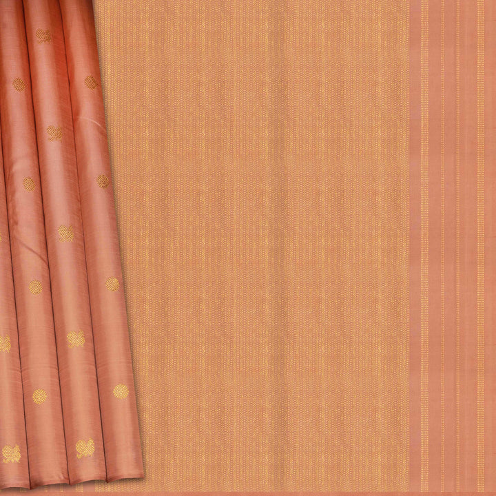 Beige peach Kanjivaram silk saree with annam and chakram butta, gold zari lined pallu and matching monotone blouse