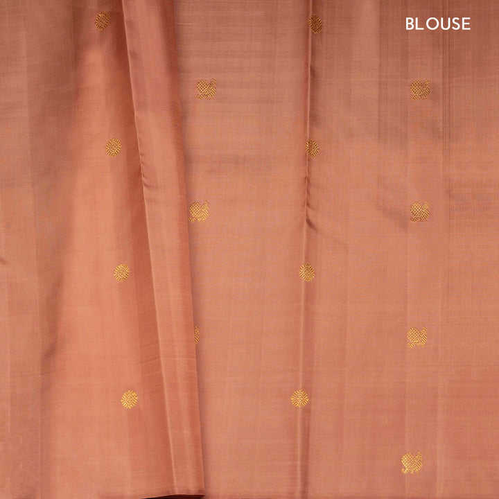Beige peach Kanjivaram silk saree with annam and chakram butta, gold zari lined pallu and matching monotone blouse