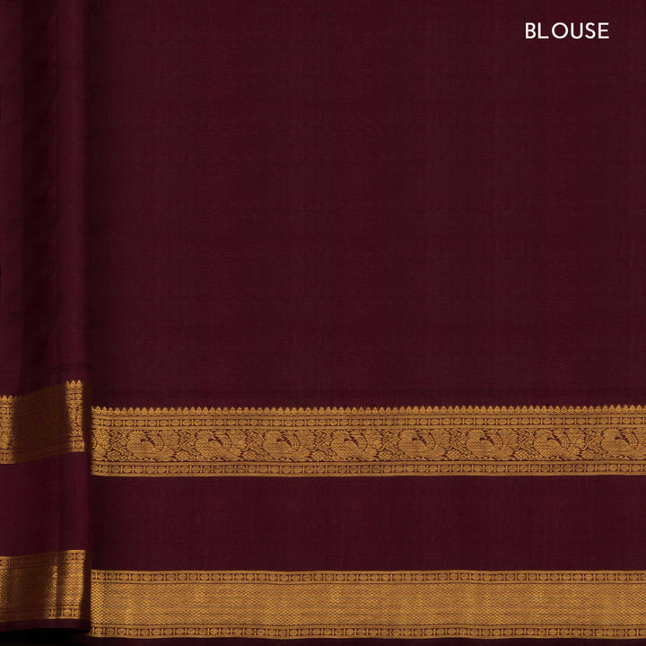 Pink Kanjivaram silk saree with annam and chakram butta, maroon rettapet border and rich traditional pallu with matching blouse