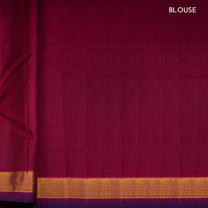 Blue Kanjivaram silk saree with mango butta, violet getti border and chevron diamond panel pallu with contrast blouse
