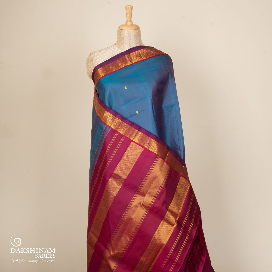 Blue Kanjivaram silk saree with mango butta, violet getti border and chevron diamond panel pallu with contrast blouse