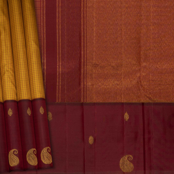 Yellow Kanjivaram silk saree with maroon checks, floral and mango butta border, and panel line pallu with matching blouse