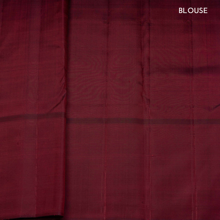 Yellow Kanjivaram silk saree with maroon checks, floral and mango butta border, and panel line pallu with matching blouse
