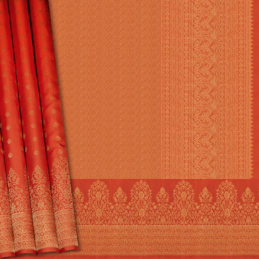 Orange Kanjivaram silk saree with allover diamond butta, turning border and rich pallu with rudraksham, chevron lines and retta killi motifs