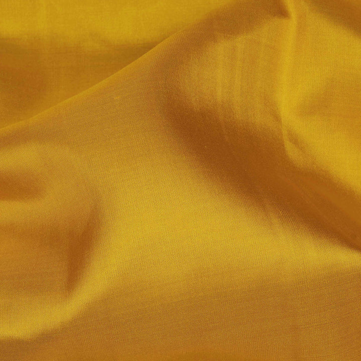 Yellow Kanjivaram silk saree with plain body, aqua blue dual-tone getti border and blue green paneled pallu with matching blouse