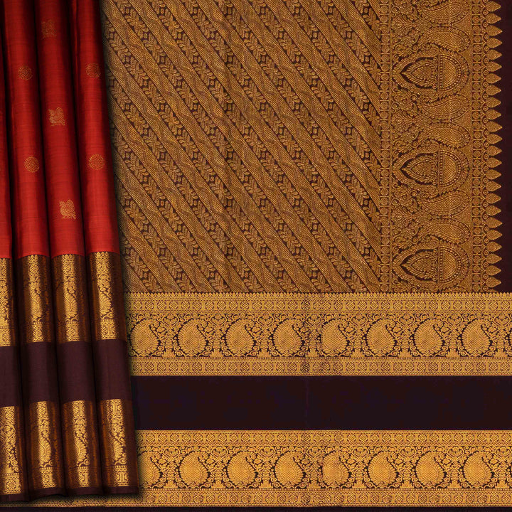 Rust orange Kanjivaram silk saree with annam and chakram butta, brown rettapet border and rich traditional pallu with matching blouse