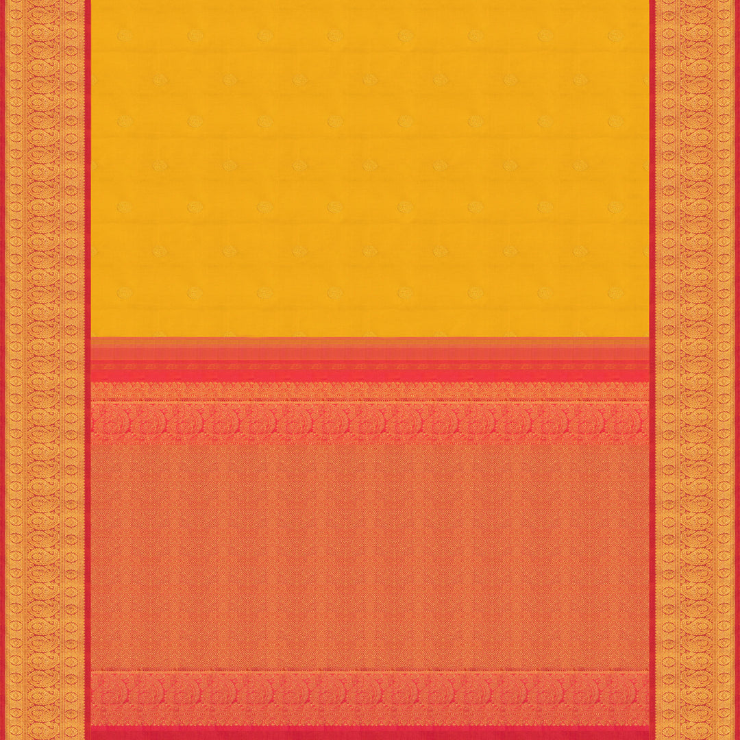 Yellow Kanjivaram silk saree with mayil buttas, pink korvai border featuring chakram and mango motifs, paired with plain pink blouse.