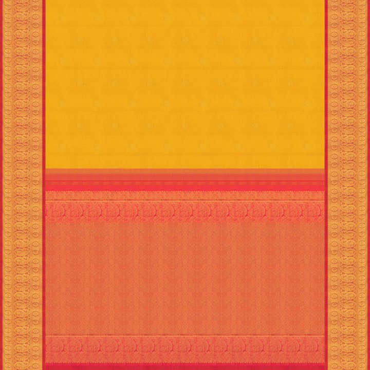 Yellow Kanjivaram silk saree with mayil buttas, pink korvai border featuring chakram and mango motifs, paired with plain pink blouse.