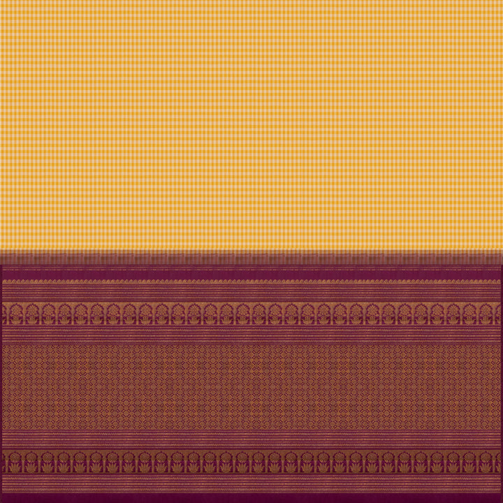 Beige and yellow small checked Kanjivaram silk saree with purple pallu featuring floral motifs, chevron and chakram designs, paired with dotted butta blouse.