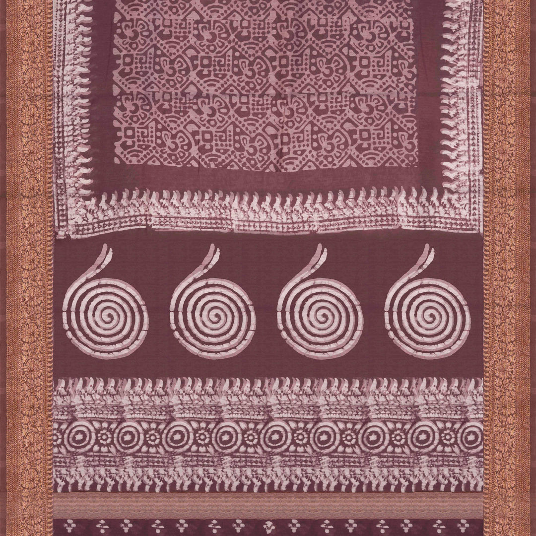 Brown handwoven silk cotton saree with batik design, gold zari floral border and artistic pallu