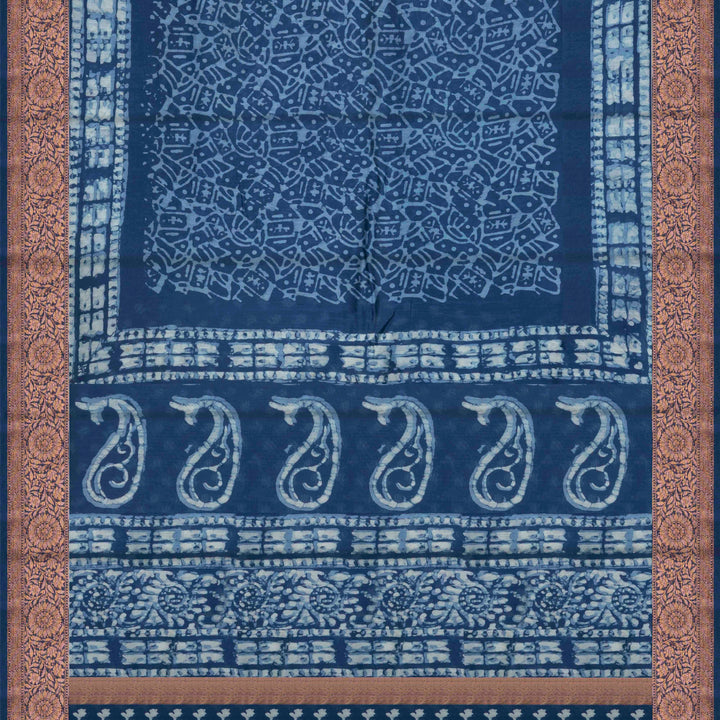 Blue Chanderi silk cotton saree with white batik print, copper zari floral border and batik mango pallu