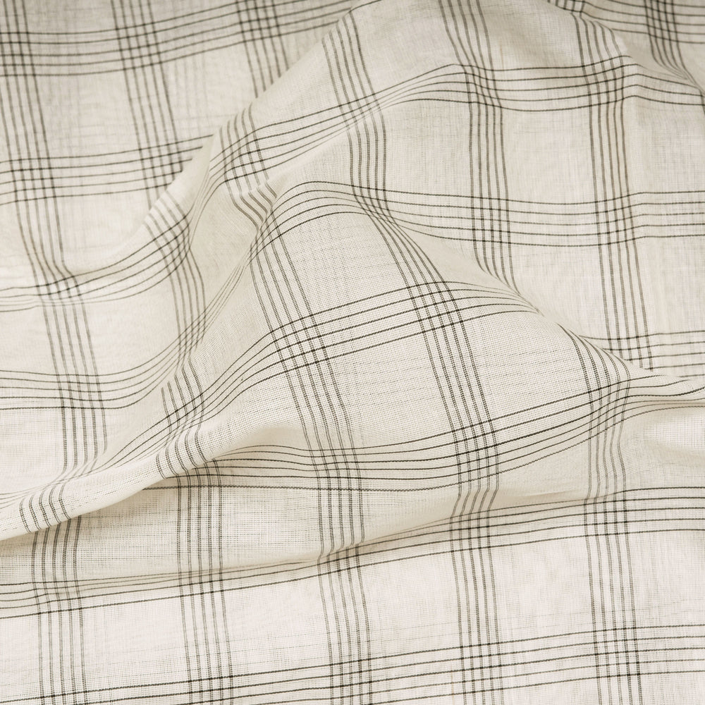 White Gadwal cotton saree with black checks, red Korvai temple border and brown pallu