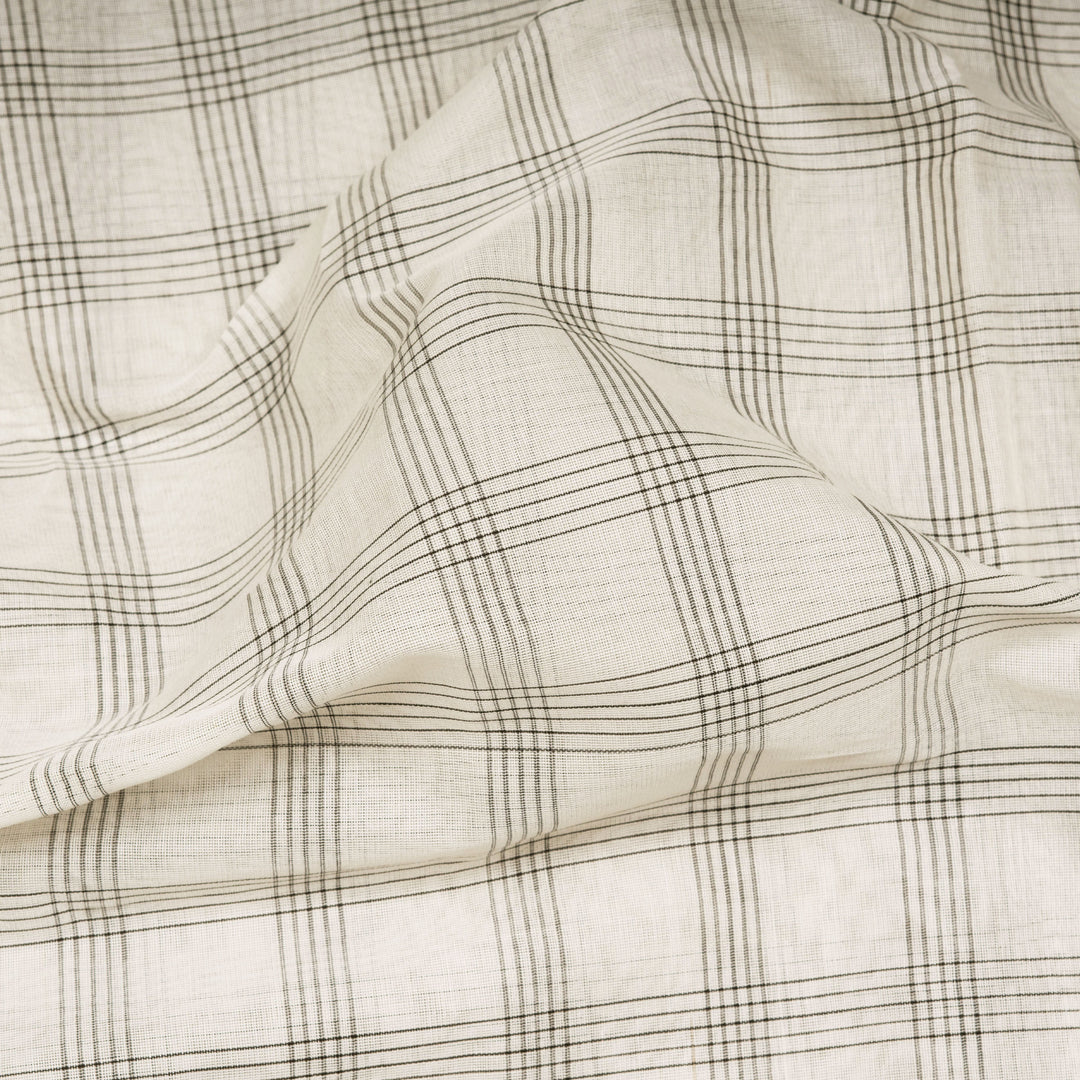 White Gadwal cotton saree with black checks, red Korvai temple border and brown pallu