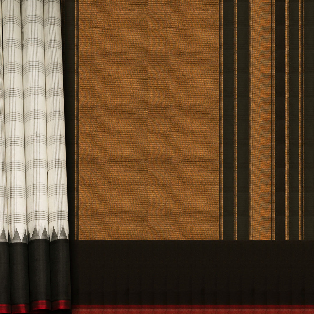 White Gadwal cotton saree with black checks, red Korvai temple border and brown pallu