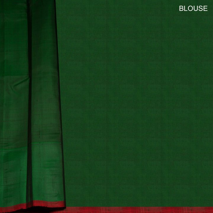 Yellow and pink checked Gadwal cotton saree with green Korvai temple border and striped pallu