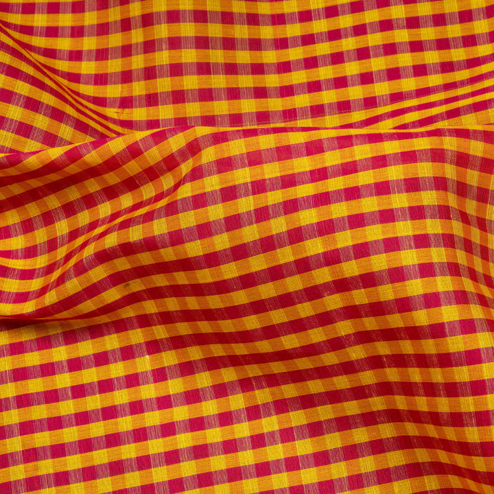 Yellow and pink checked Gadwal cotton saree with green Korvai temple border and striped pallu