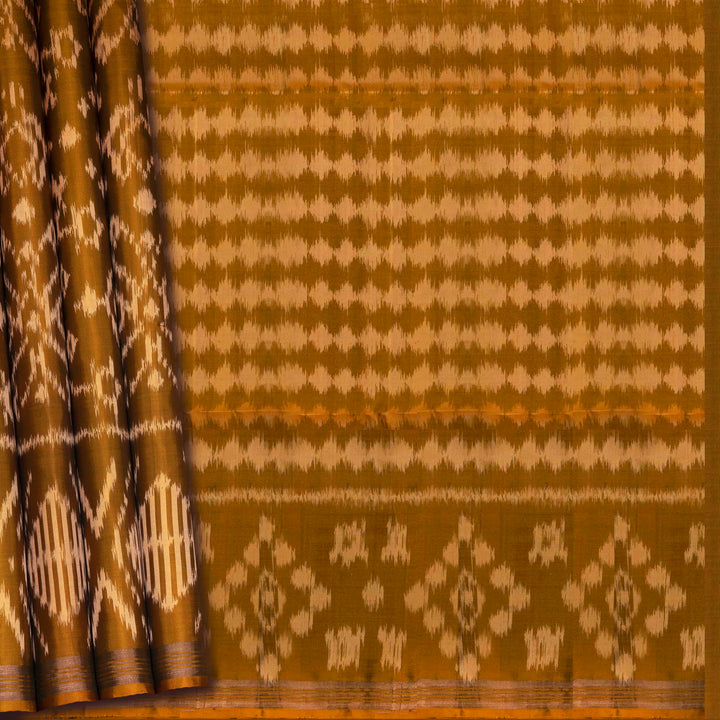 Mustard handwoven Ikat soft silk saree with white Ikat motifs and matching border