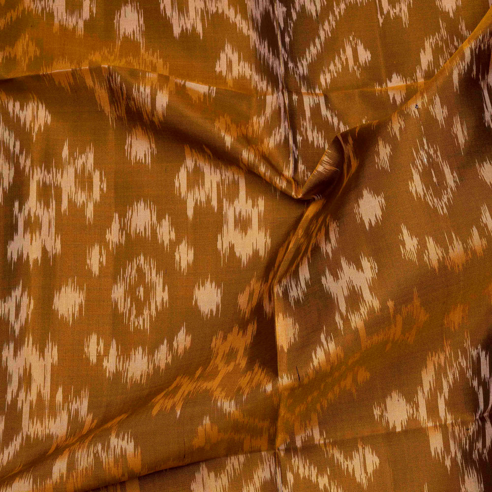Mustard handwoven Ikat soft silk saree with white Ikat motifs and matching border