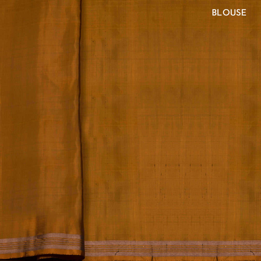 Mustard handwoven Ikat soft silk saree with white Ikat motifs and matching border