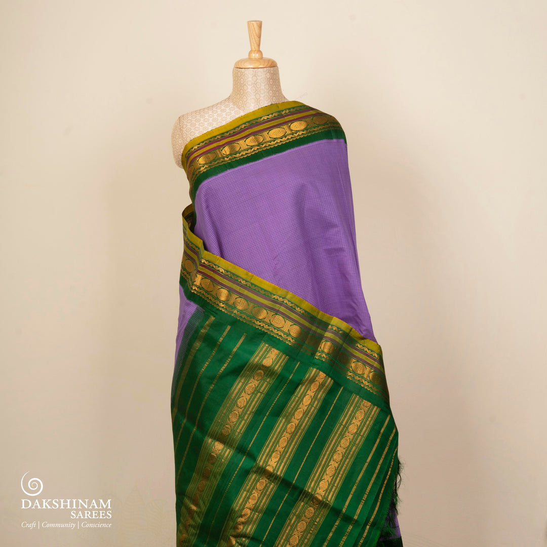 Violet checked Gadwal cotton saree with green Korvai silk border, gold zari Rudraksham motifs and green pallu
