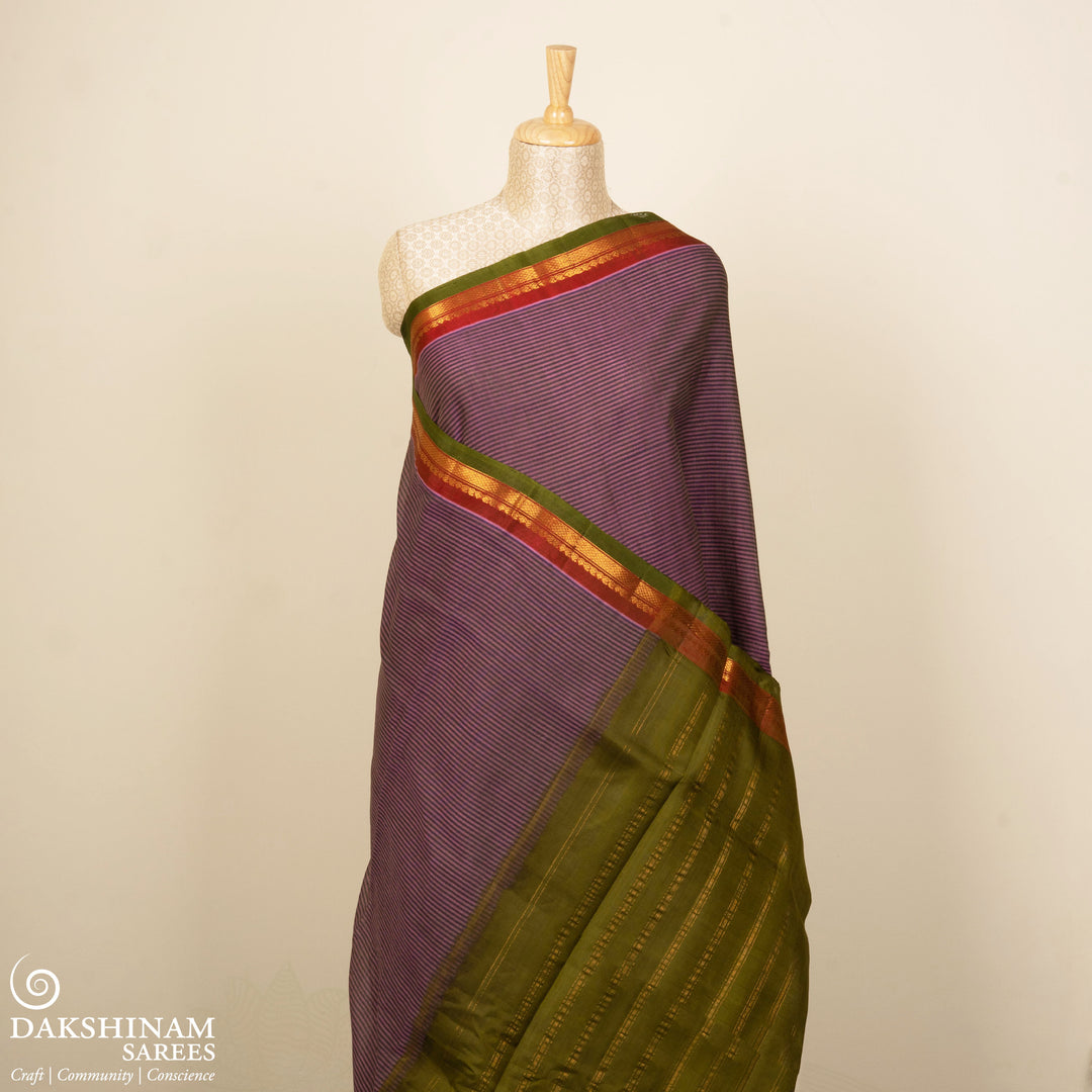 Violet Gadwal cotton saree with blue stripes, green border, gold zari detailing and striped pallu