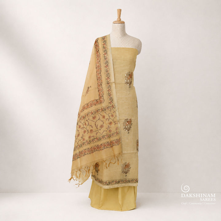 Elegant beige 3-piece suit set featuring floral prints with intricate applique work on a tissue base. Paired with a plain beige bottom and a floral printed Chanderi silk cotton dupatta for a graceful ethnic look.