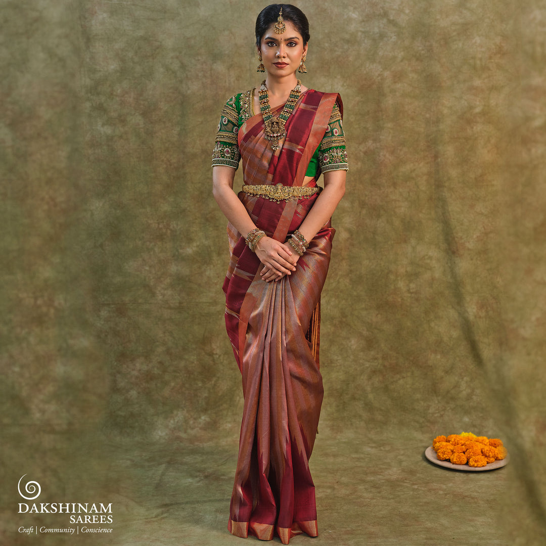 Maroon Kanjivaram silk saree with gold and silver tissue zari and temple border design