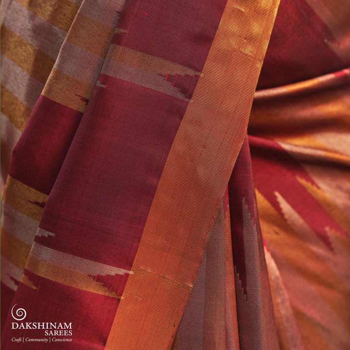 Maroon Kanjivaram silk saree with gold and silver tissue zari and temple border design