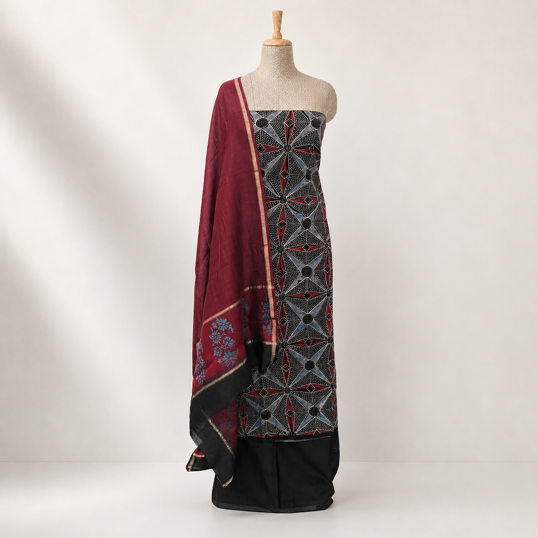 Black Ajrakh printed cotton 3-piece suit set with star motifs, plain black bottom and Chanderi floral dupatta