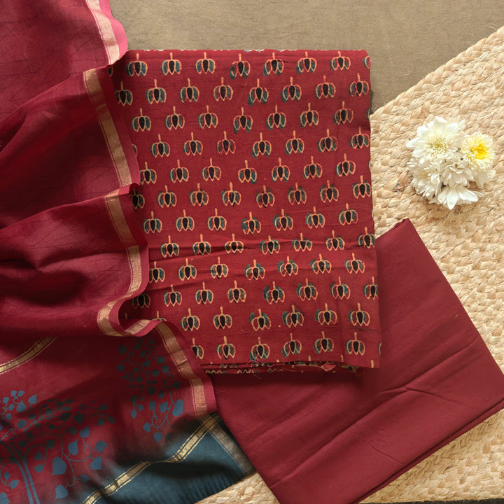 Red Ajrakh printed cotton 3-piece suit set with lotus motifs, plain red bottom and Chanderi floral dupatta