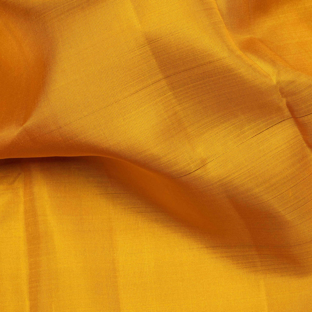 Yellow handwoven Kanjivaram silk saree with pink border, gold zari and contrast pallu