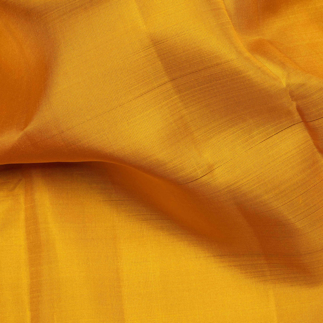 Yellow handwoven Kanjivaram silk saree with pink border, gold zari and contrast pallu
