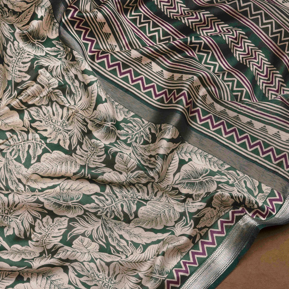 Green Chanderi silk cotton saree with white leaf print, silver zari border and striped pallu