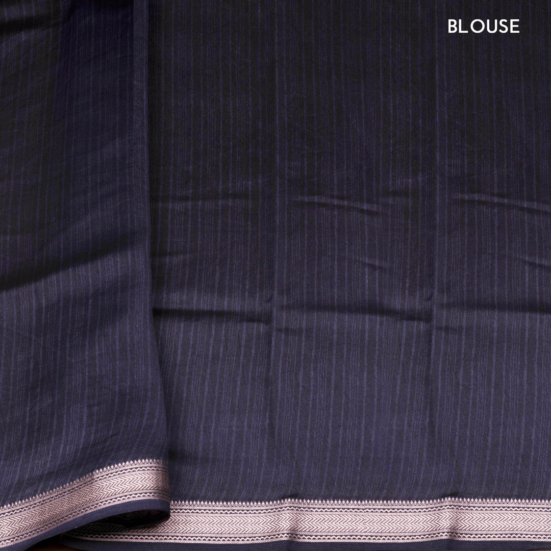 Dark blue Chanderi silk cotton saree with white leaf print, silver zari border and striped pallu