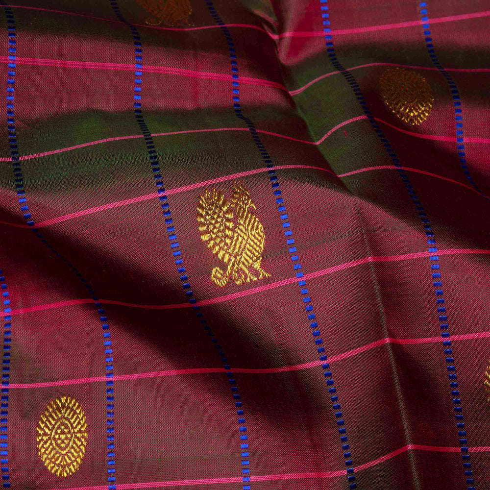 Magenta dual-tone Kanjivaram silk saree with pink border, chakram and annam motifs, and gold zari work