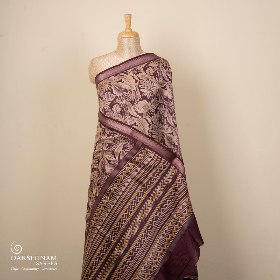 Violet Chanderi silk cotton saree with white leaf print, silver zari border and striped pallu
