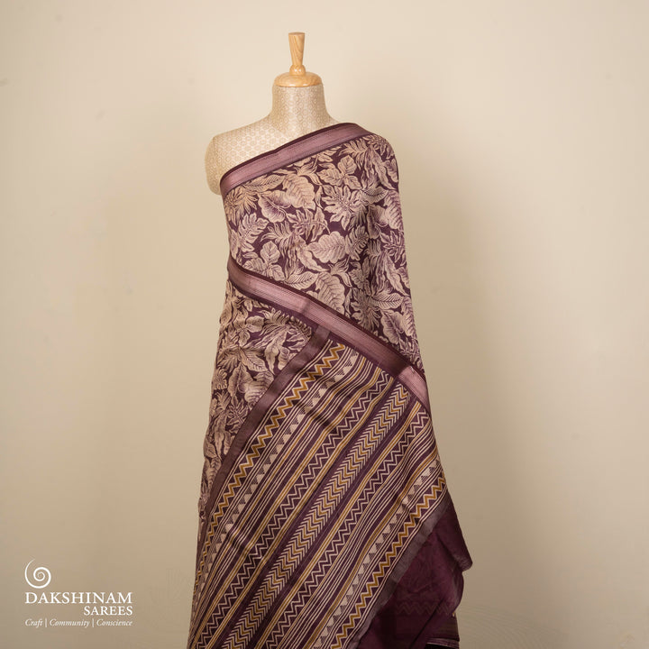 Violet Chanderi silk cotton saree with white leaf print, silver zari border and striped pallu