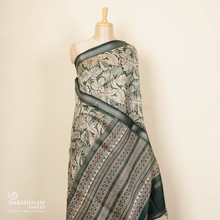 Green Chanderi silk cotton saree with white leaf print, silver zari border and striped pallu