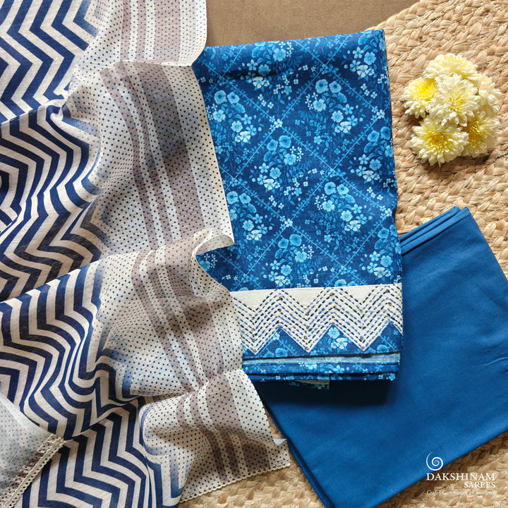 Blue and white three-piece suit set with floral buttas and chevron dupatta