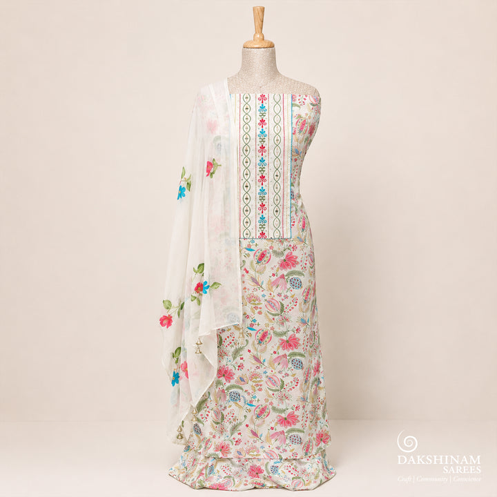 White three-piece suit set with floral embroidery, mirror work and hand-painted dupatta