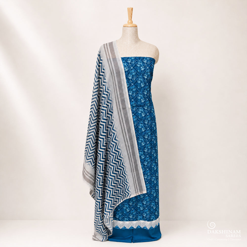 Blue and white three-piece suit set with floral buttas and chevron dupatta